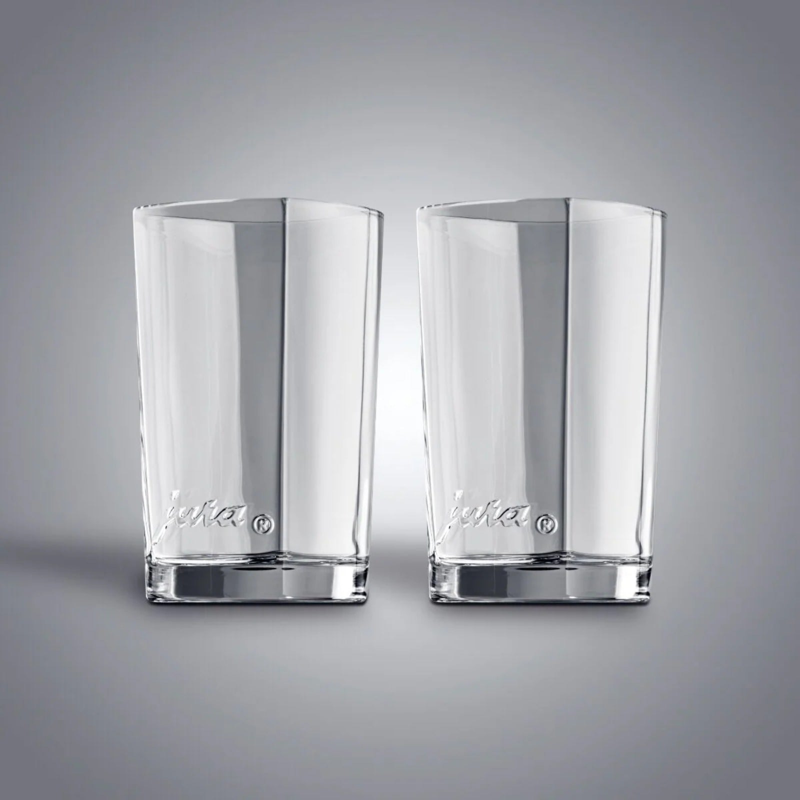 JURA Latte macchiato glass, small 2 pcs (69000) – two clear tall glasses with embossed JURA logo on the base
