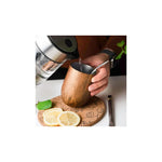 Aquafloow Wooden Yerba Maté thermocup 355 ml – hand‑held wooden cup with metal straw, pouring hot water, lemon slices
