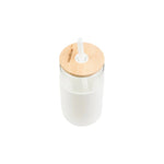 Aquafloow 500 ml jar in a white silicone sleeve with wooden lid and white straw, top view