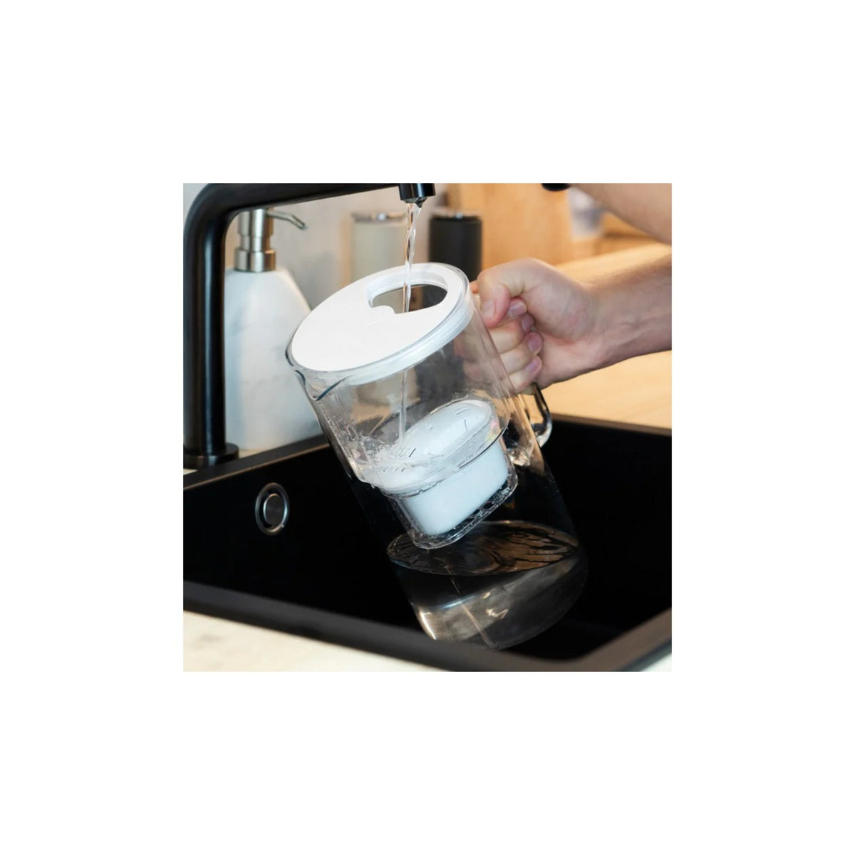 Aquafloow Maxi filter cartridge for water jugs (Replacement for Brita Maxtra and others) in a jug, cartridge visible at the bottom