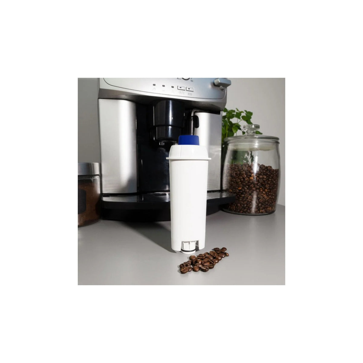 Aquafloow Longi water filter compatible with DeLonghi (replacement SER3017/DLSC002) white filter in front of a coffee machine and glass