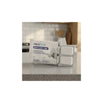 Aquafloow descaling tablets for coffee machines, kettles and irons (4 pcs) – pack and blister with white tablets on a kitchen counter
