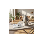 Aquafloow descaling tablets for coffee machines, kettles and irons (4 pcs) – pack of tablets placed on an ironing board next to an iron