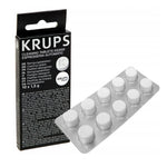 Black KRUPS Cleaning Tablets XS3000 packaging beside a silver blister with ten round white tablets
