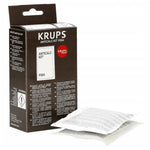 Brown-white Krups Anticalc Kit F054 box with logo and two white single-use sachets with item text beside it